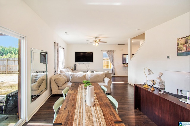 dining space with plenty of natural light, ceiling fan, and dark wood-style flooring