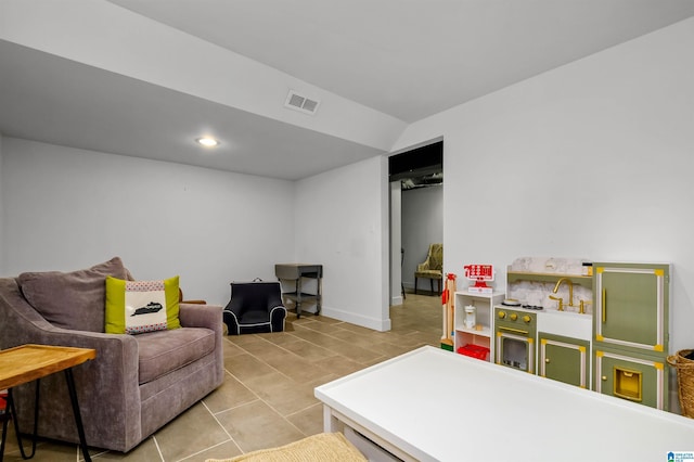 interior space featuring tile patterned floors, visible vents, recessed lighting, and baseboards