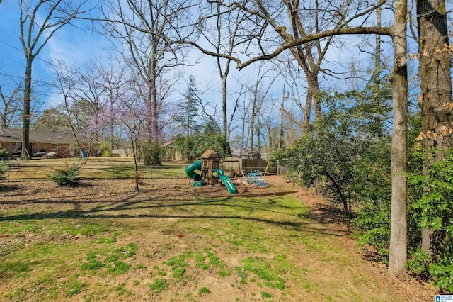 view of yard with fence and playground community