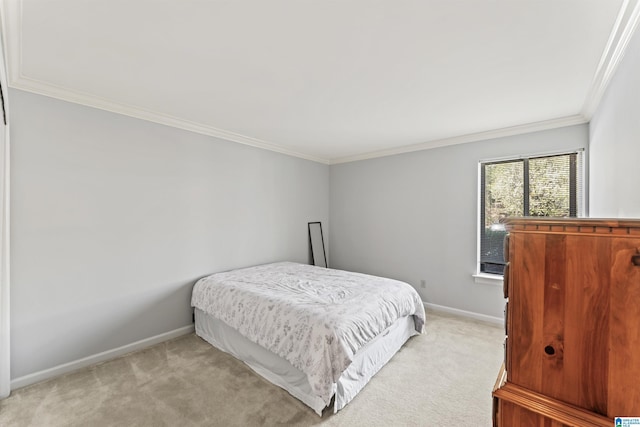 bedroom with crown molding, baseboards, and light carpet