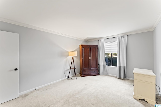 unfurnished bedroom with baseboards, light carpet, and ornamental molding