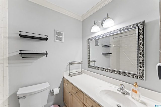 bathroom featuring vanity, visible vents, tiled shower, ornamental molding, and toilet