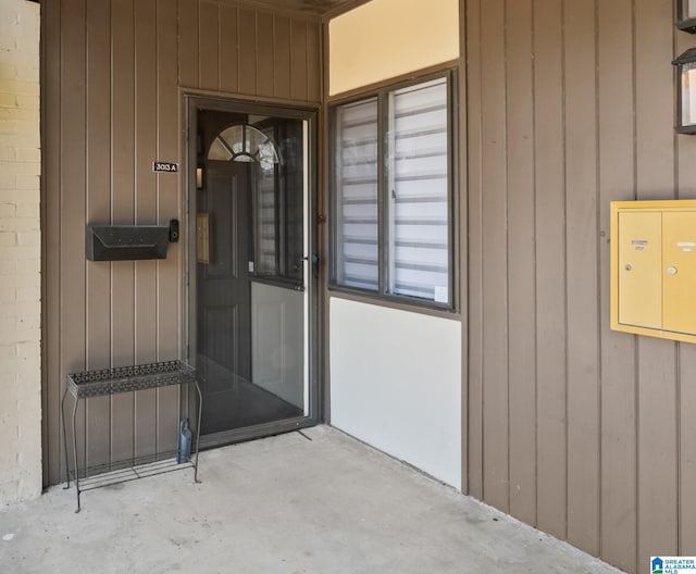 entrance to property with brick siding