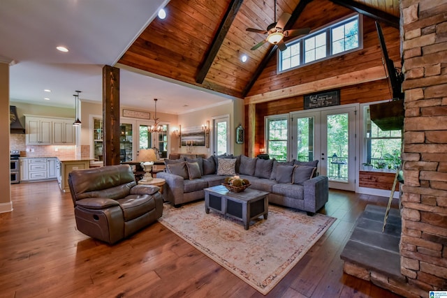 living room featuring ornamental molding, beam ceiling, wooden ceiling, french doors, and hardwood / wood-style flooring