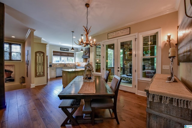 dining room featuring crown molding, baseboards, recessed lighting, a notable chandelier, and dark wood-style flooring