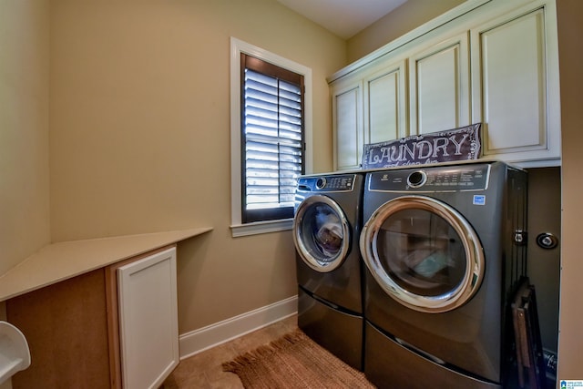 laundry room featuring tile patterned floors, cabinet space, independent washer and dryer, and baseboards