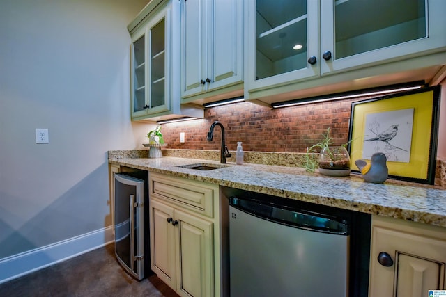 kitchen with beverage cooler, decorative backsplash, a sink, dishwashing machine, and light stone countertops