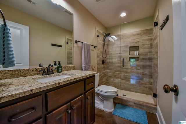 bathroom with visible vents, a stall shower, toilet, and vanity