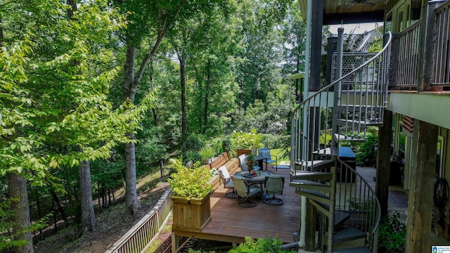 view of wooden balcony with stairway and a deck