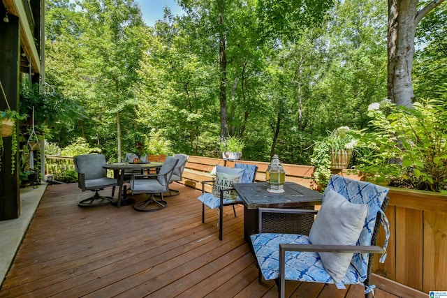 wooden terrace featuring outdoor dining area