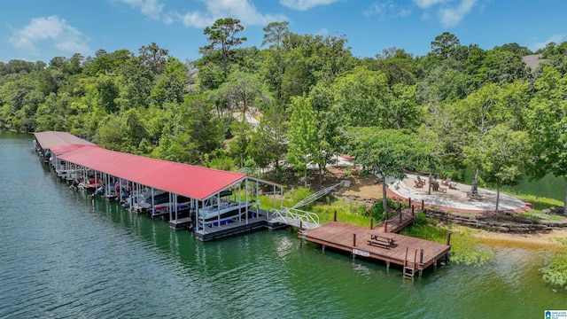 dock area with a water view and boat lift