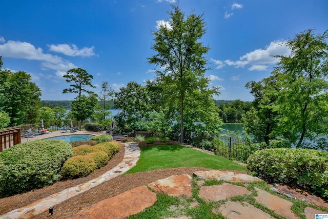 view of yard with a fenced in pool, a patio, and a fenced backyard