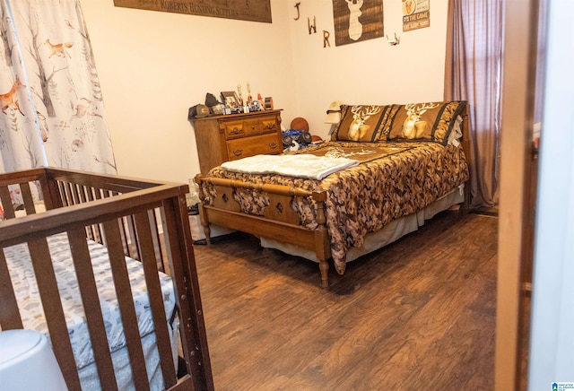 bedroom with wood finished floors