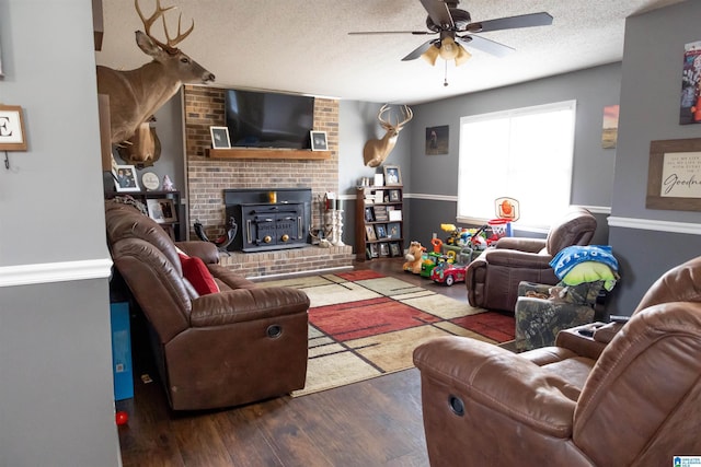 living area featuring a textured ceiling, ceiling fan, and wood finished floors