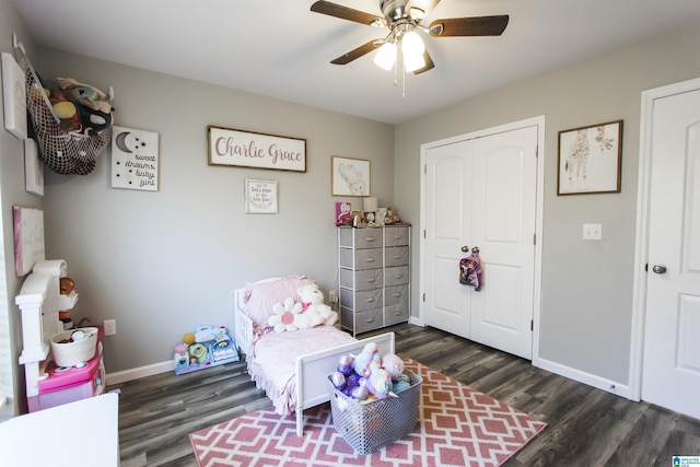 bedroom with a closet, ceiling fan, baseboards, and wood finished floors