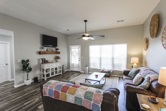 living room featuring visible vents, a ceiling fan, dark wood-type flooring, and baseboards