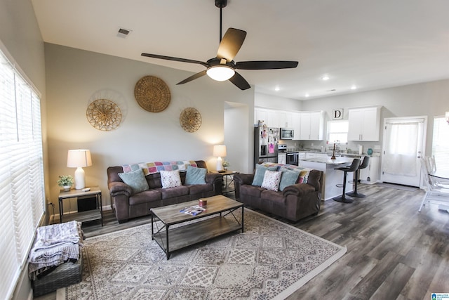 living room with visible vents, recessed lighting, a ceiling fan, and wood finished floors