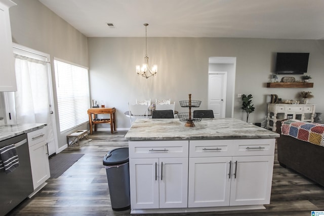 kitchen featuring light stone counters, white cabinets, dishwasher, and dark wood-type flooring