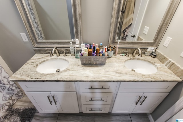 bathroom with a sink and double vanity