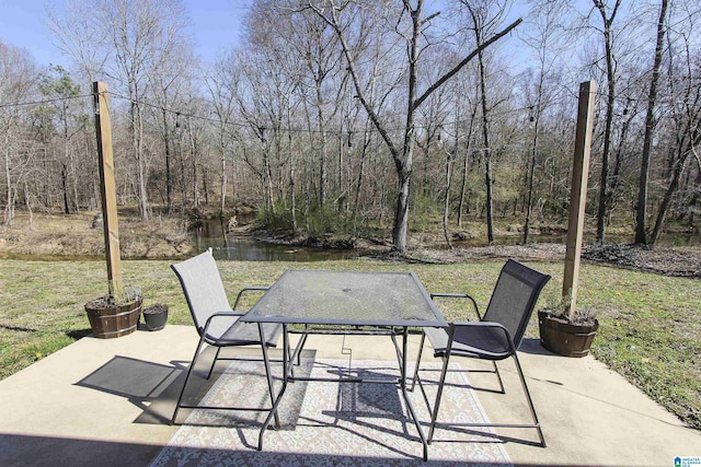 view of patio / terrace with a view of trees