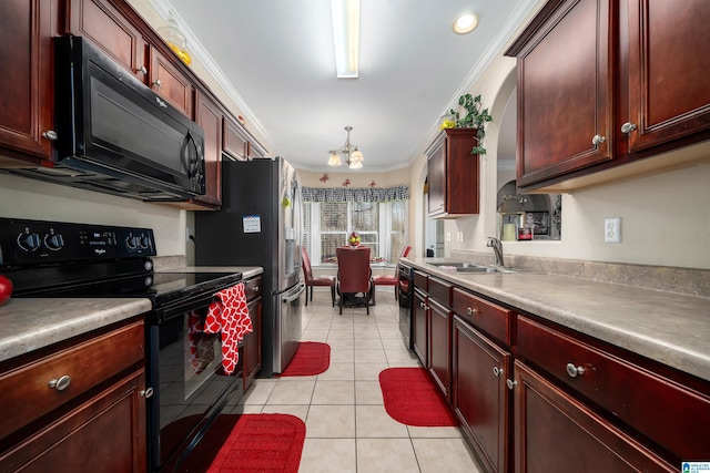 kitchen with ornamental molding, a sink, black appliances, reddish brown cabinets, and a chandelier