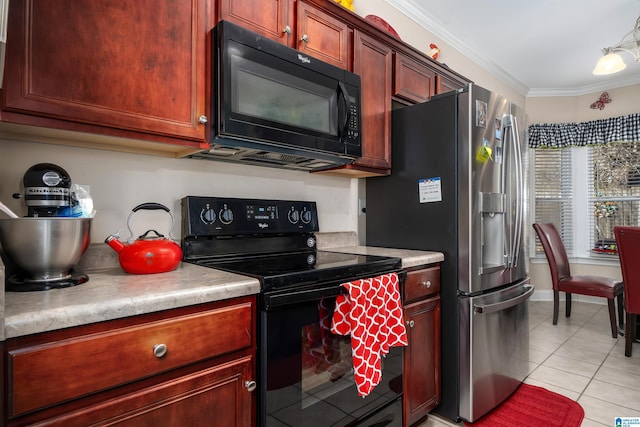 kitchen featuring light tile patterned flooring, black appliances, light countertops, and ornamental molding