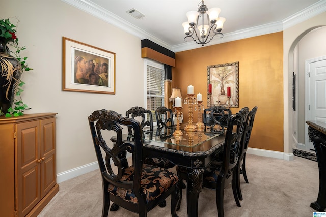 dining area with an inviting chandelier, light colored carpet, visible vents, and arched walkways