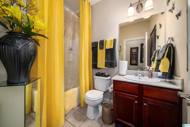 bathroom with tile patterned flooring, toilet, vanity, and shower / bath combo with shower curtain