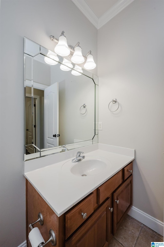 bathroom with vanity, baseboards, and crown molding