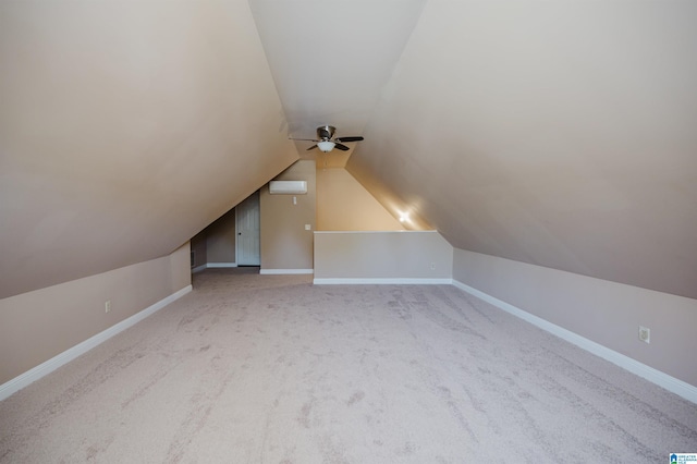 bonus room with baseboards, carpet floors, ceiling fan, and lofted ceiling