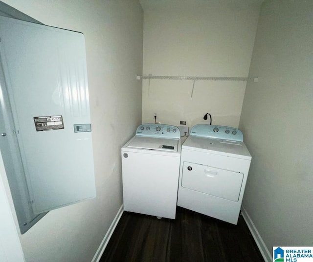 washroom with laundry area, baseboards, independent washer and dryer, and dark wood-style flooring