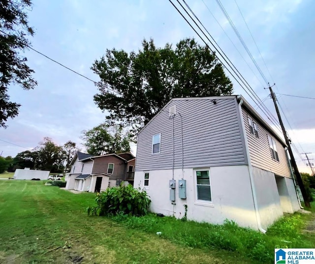 rear view of house with a yard