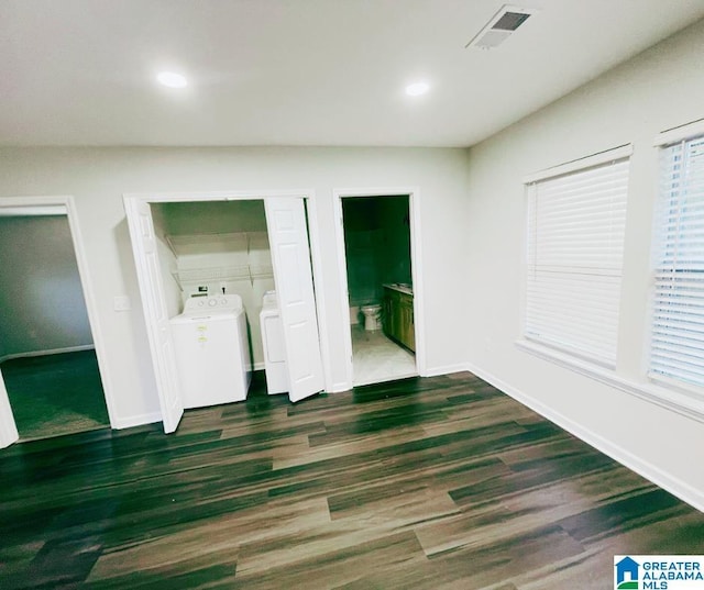 interior space with visible vents, washer and dryer, wood finished floors, recessed lighting, and baseboards