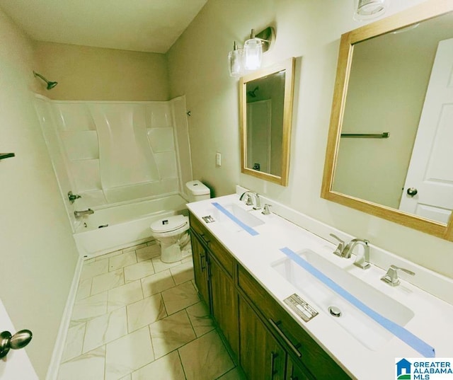 full bath with marble finish floor, toilet, shower / bath combination, and a sink