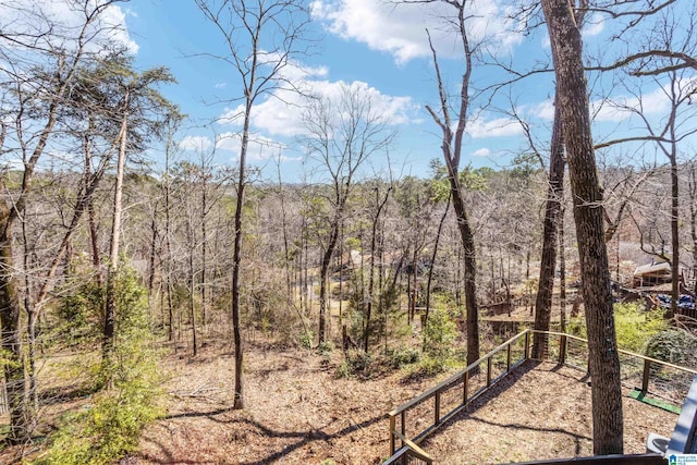 exterior space with a forest view