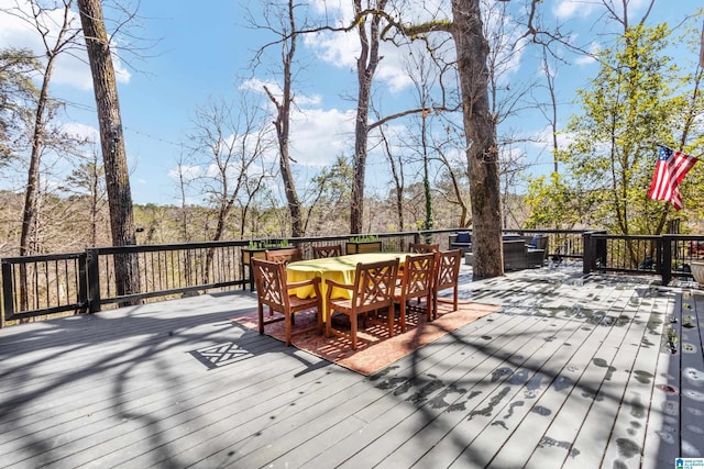 wooden deck with outdoor dining area