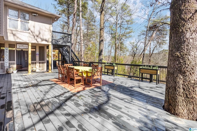 wooden deck with outdoor dining area