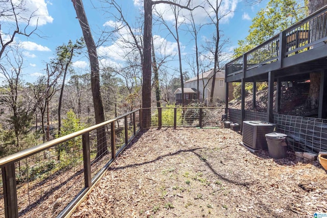 view of yard with a deck and cooling unit