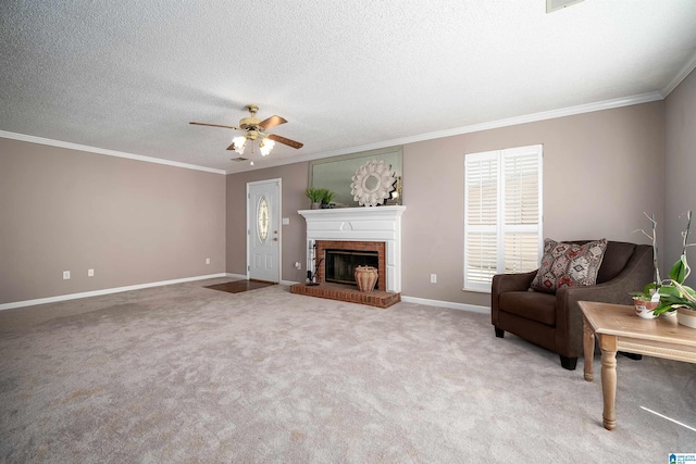 living area featuring ornamental molding, a textured ceiling, carpet floors, a fireplace, and baseboards