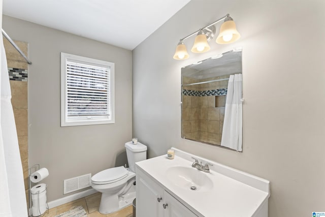 bathroom featuring tile patterned flooring, visible vents, toilet, tiled shower, and vanity