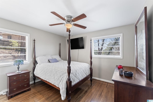 bedroom with wood finished floors, baseboards, and ceiling fan