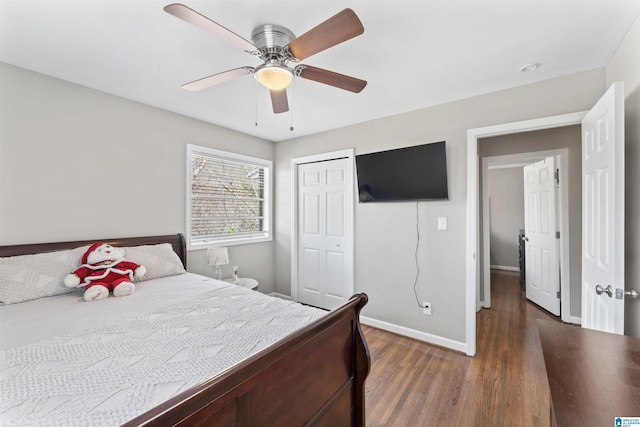 bedroom featuring a closet, ceiling fan, baseboards, and wood finished floors