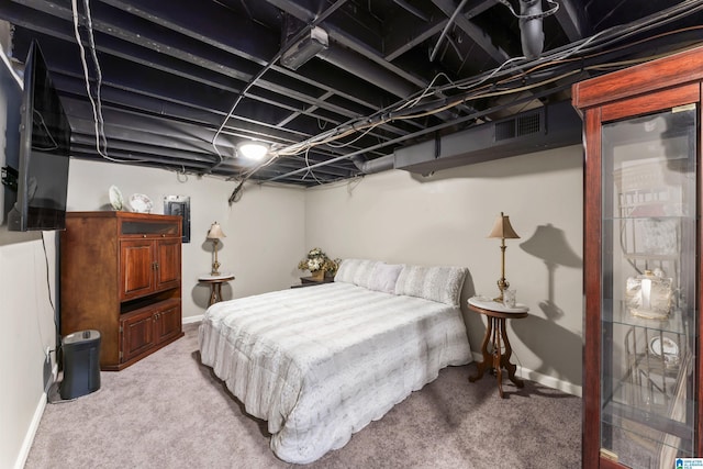 carpeted bedroom featuring visible vents and baseboards