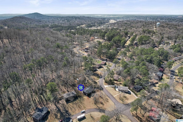 bird's eye view featuring a wooded view