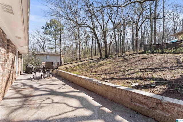 view of patio / terrace featuring fence