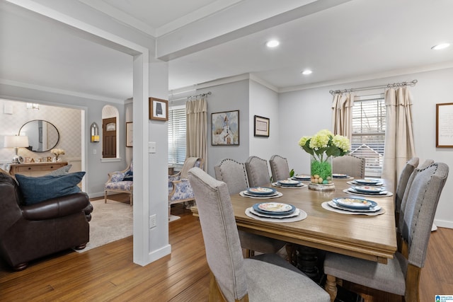 dining area with recessed lighting, baseboards, wood finished floors, and crown molding