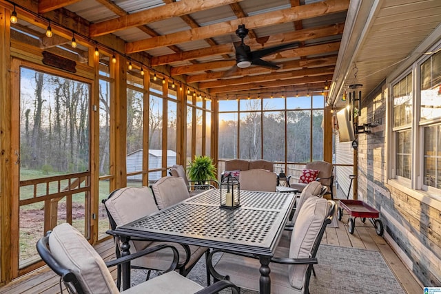 sunroom featuring a ceiling fan