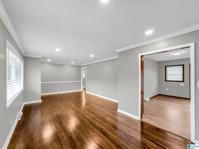 empty room featuring recessed lighting, baseboards, and wood finished floors