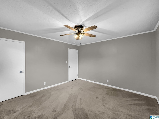 interior space featuring a ceiling fan, carpet, baseboards, a textured ceiling, and crown molding