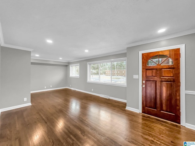 entryway featuring dark wood-style floors, recessed lighting, baseboards, and ornamental molding